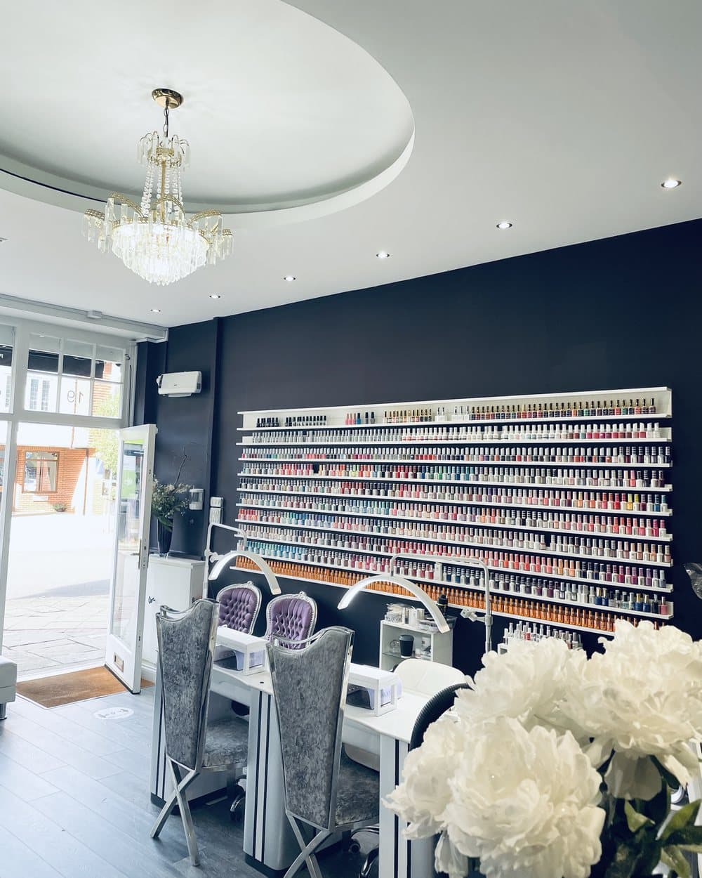 The gel polish wall, the desks and the door onto the street