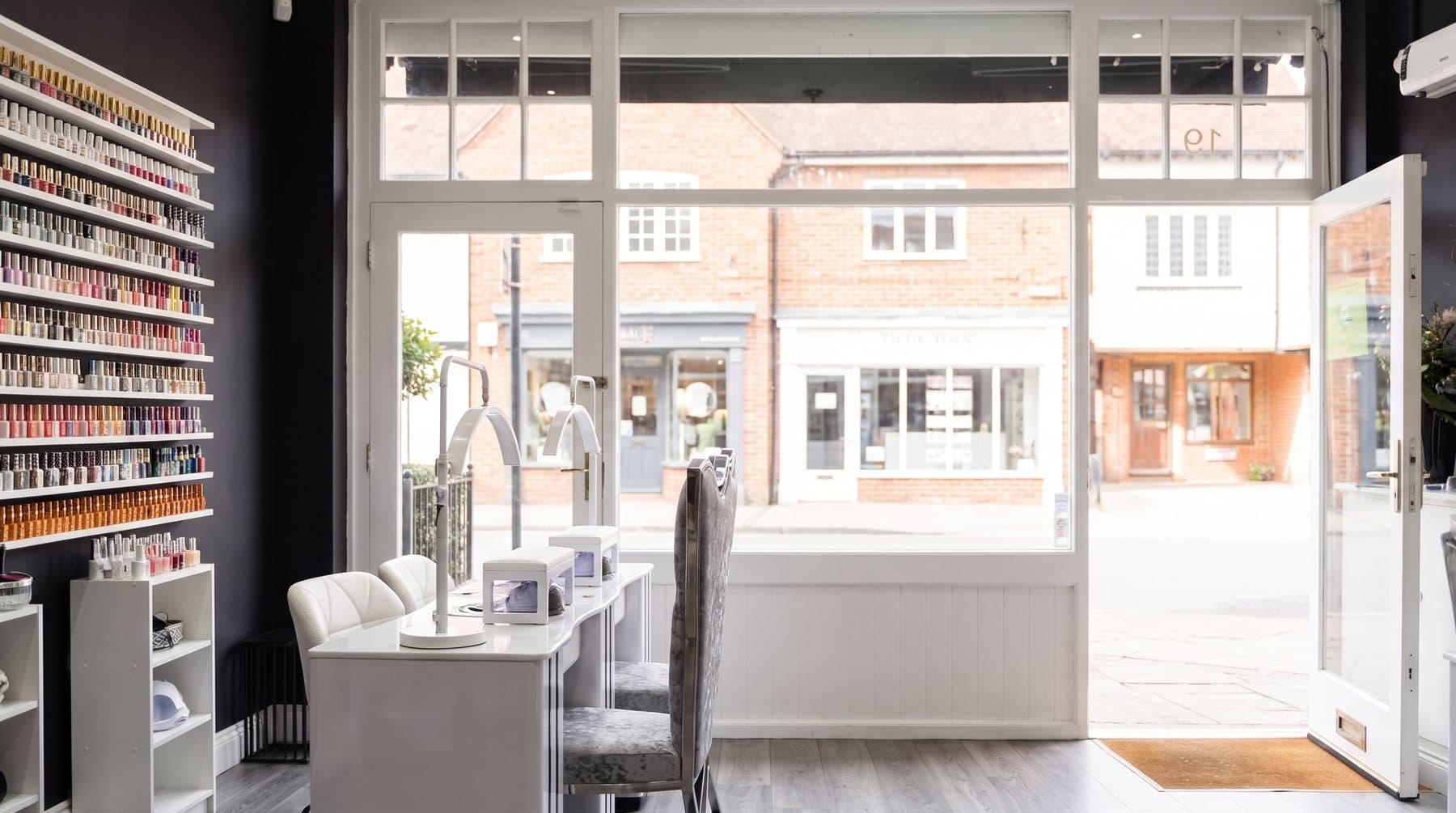 Looking out through the shop window to Station Approach