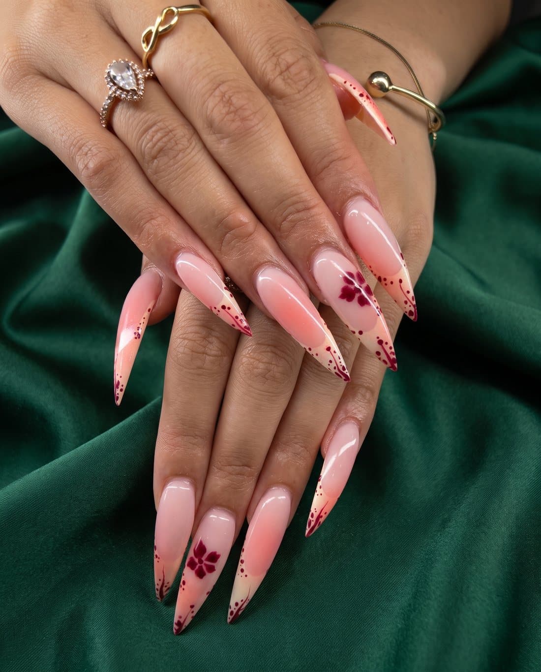 Long pink ombre stiletto nails with burgundy flower art
